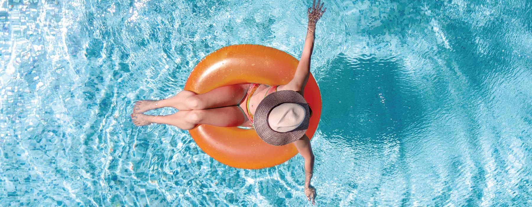 a person floating in a pool