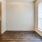 a room with a large window and a wood floor