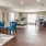 a large room with a wood floor and chairs