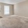 a living room with a door and a window